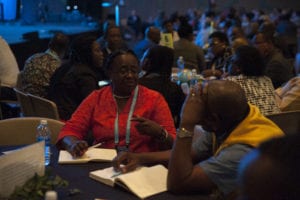 People conversing at the partner meeting 