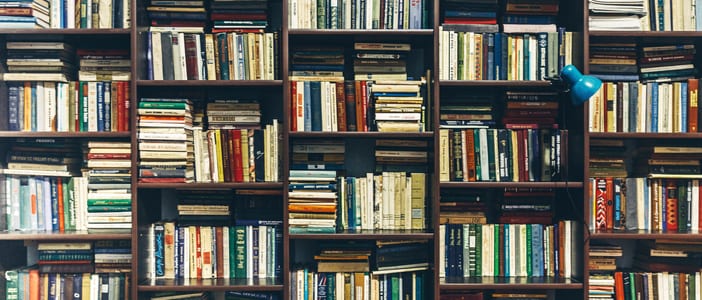 Book shelves in library. Creativity Background Concept