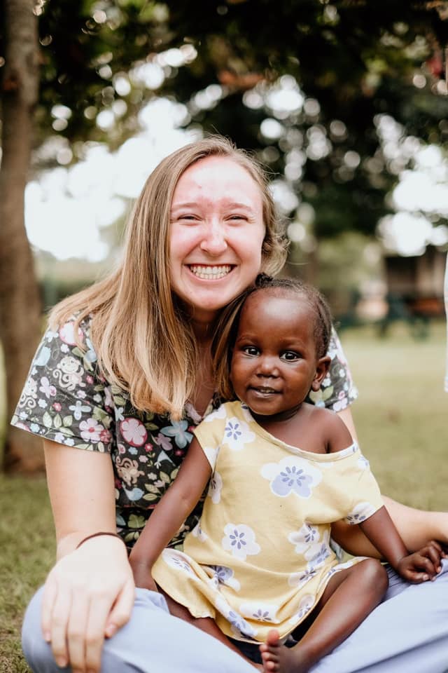 Kara in Uganda with a young girl