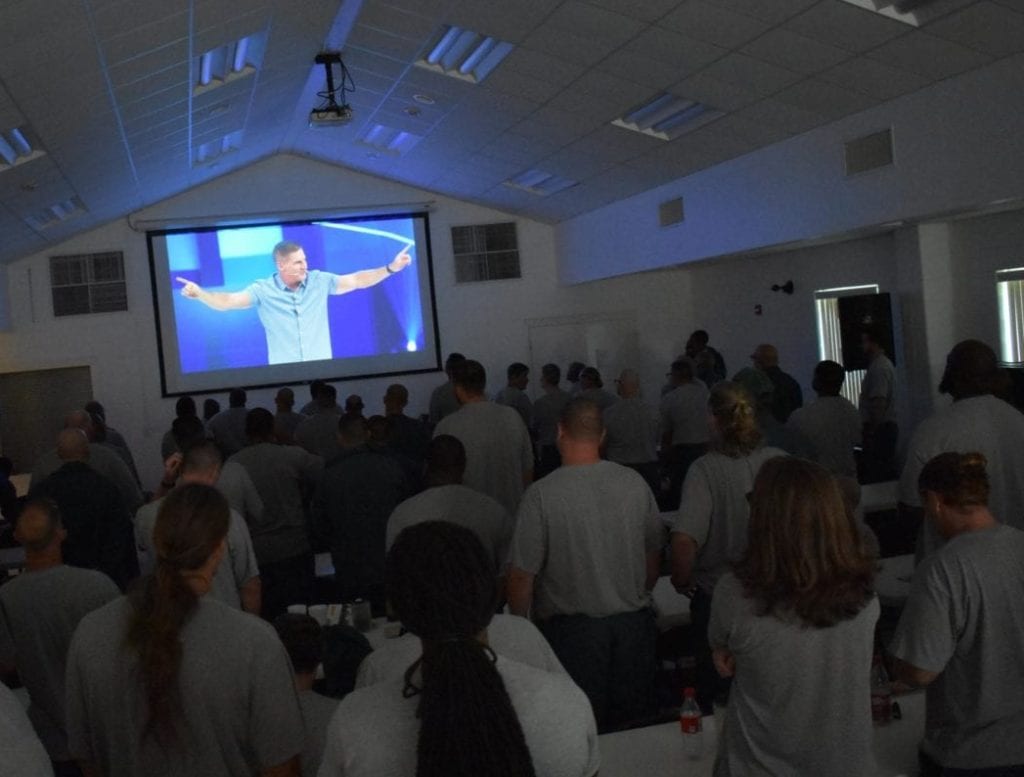 A group of inmates gather together to hear Craig Groeschel at the GLS19.