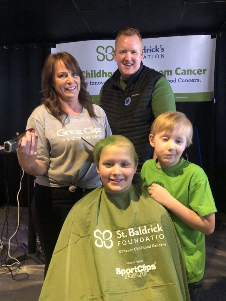 Noah and Jonah Goodall shaving Noah's head