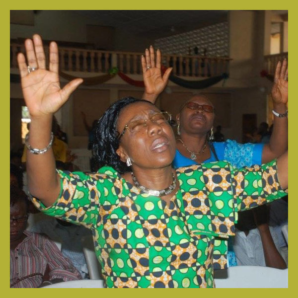 Woman worshiping at the GLS.